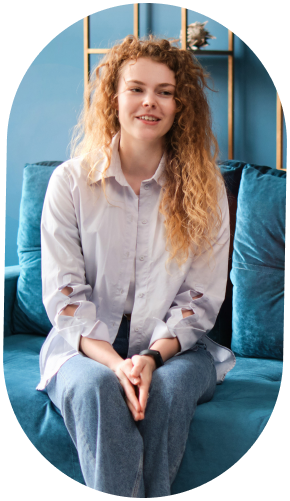 Woman sits on couch